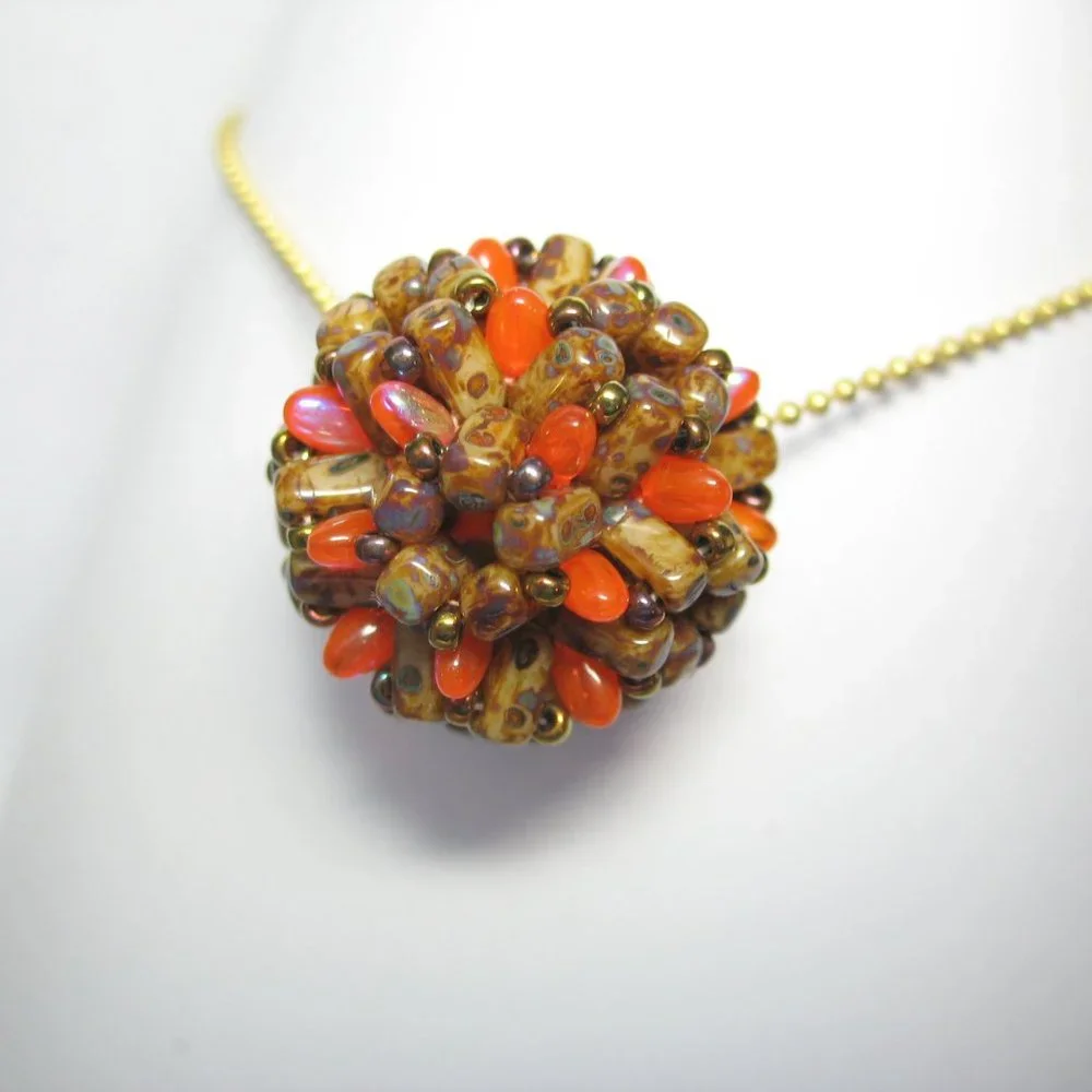 Handwoven Fall color beaded bead pendant